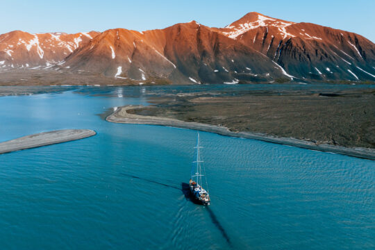 Valiente sailing in polar summer Arctic Svalbard