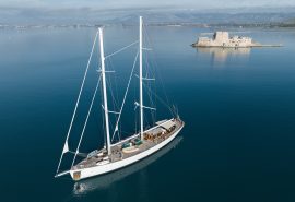 View of Kairos anchored in calm waters in the Mediterranean