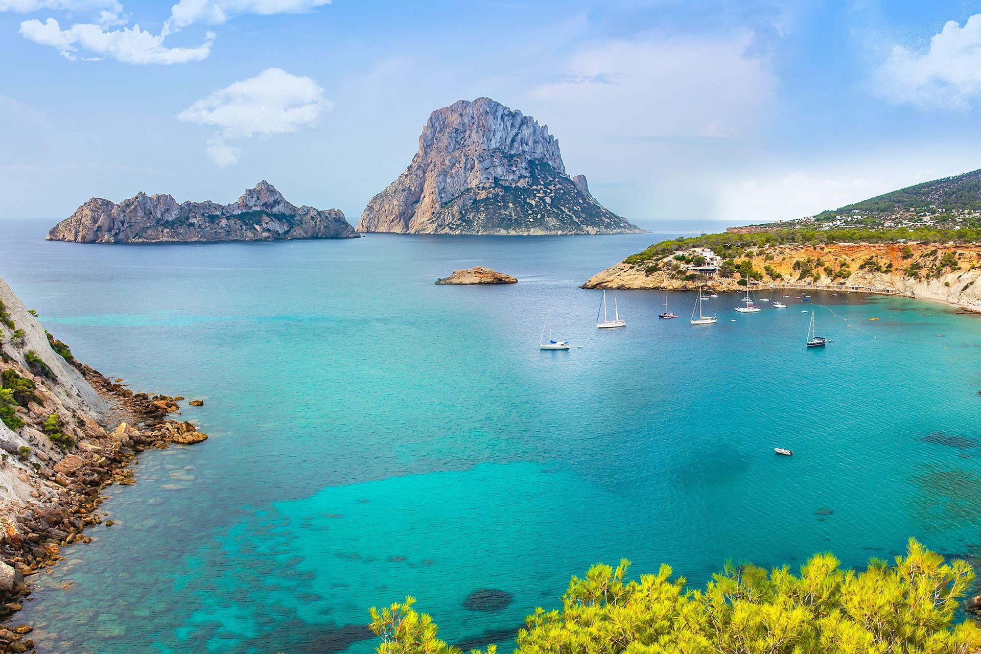 View of coast in Ibiza, Spain yachts anchored