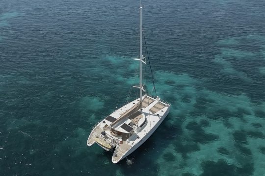Zorba Catamaran anchored in calm waters Greece