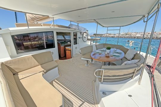 Zorba catamaran outdoor seating dining area on deck