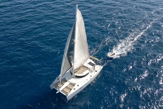 Zorba catamaran under full sail from above in Greece
