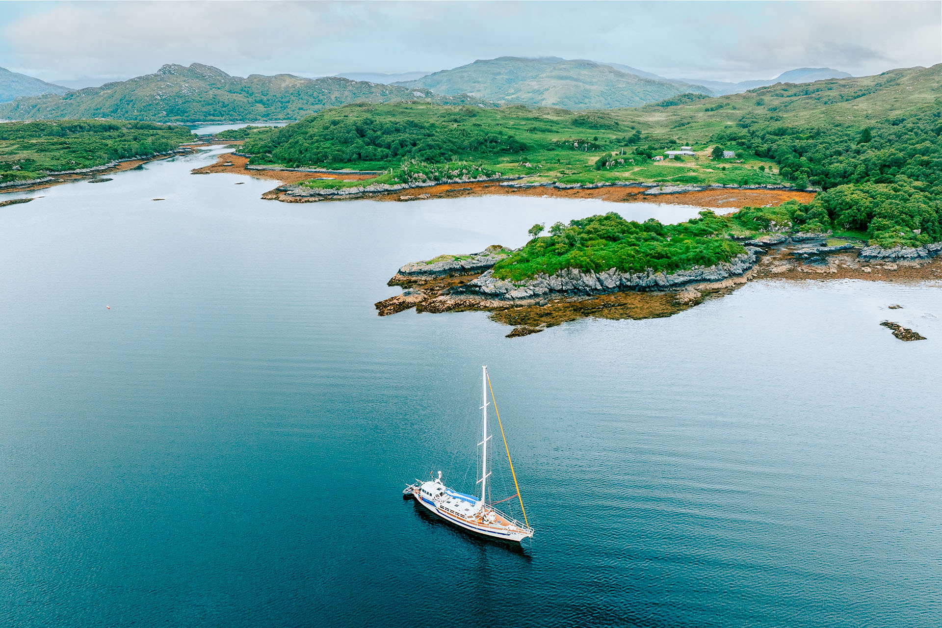 Zuza expedition yacht anchored off islands of the Scottish Hebrides, Scotland