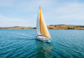Zuza expedition yacht in full sail, Hebrides, Scotland