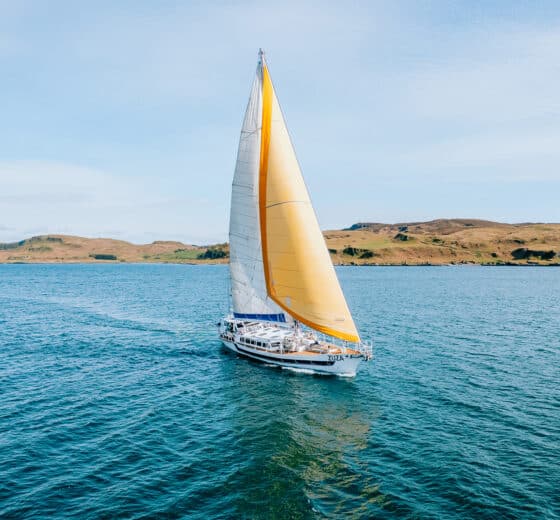 Zuza expedition yacht in full sail, Hebrides, Scotland