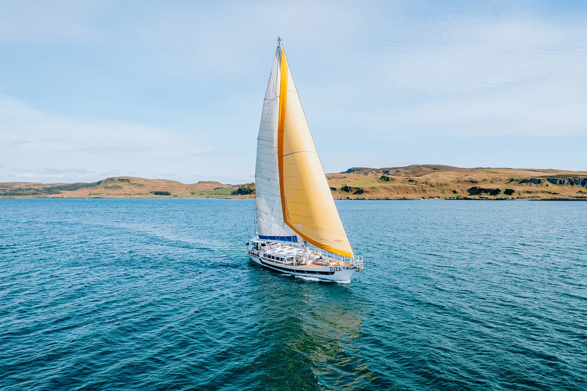 Zuza expedition yacht in full sail, Hebrides, Scotland