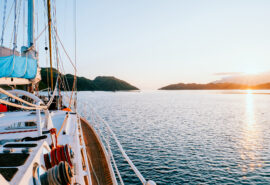 Zuza expedition yacht on deck at sunset in Scotland, Hebrides