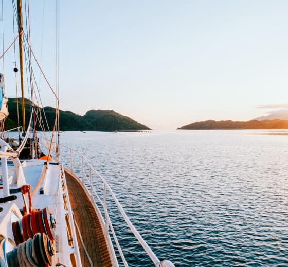 Zuza expedition yacht on deck at sunset in Scotland, Hebrides