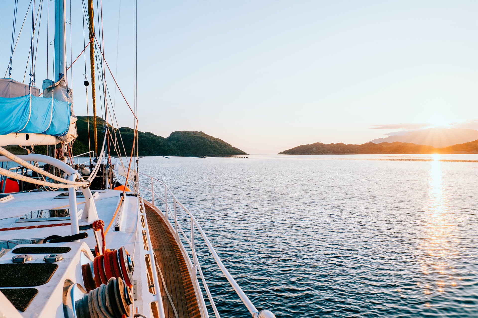 Zuza expedition yacht on deck at sunset in Scotland, Hebrides