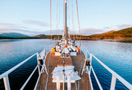 Zuza expedition yacht on deck sailing in the Scottish Hebrides, Scotland