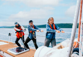 Zuza guests and crew onboard pulling ropes sailing