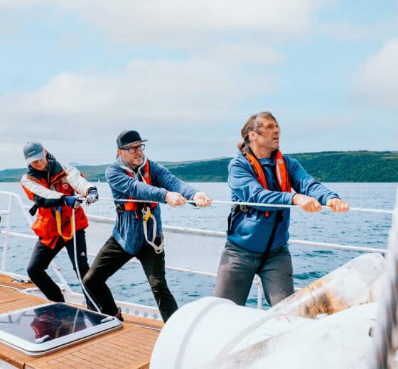 Zuza guests and crew onboard pulling ropes sailing