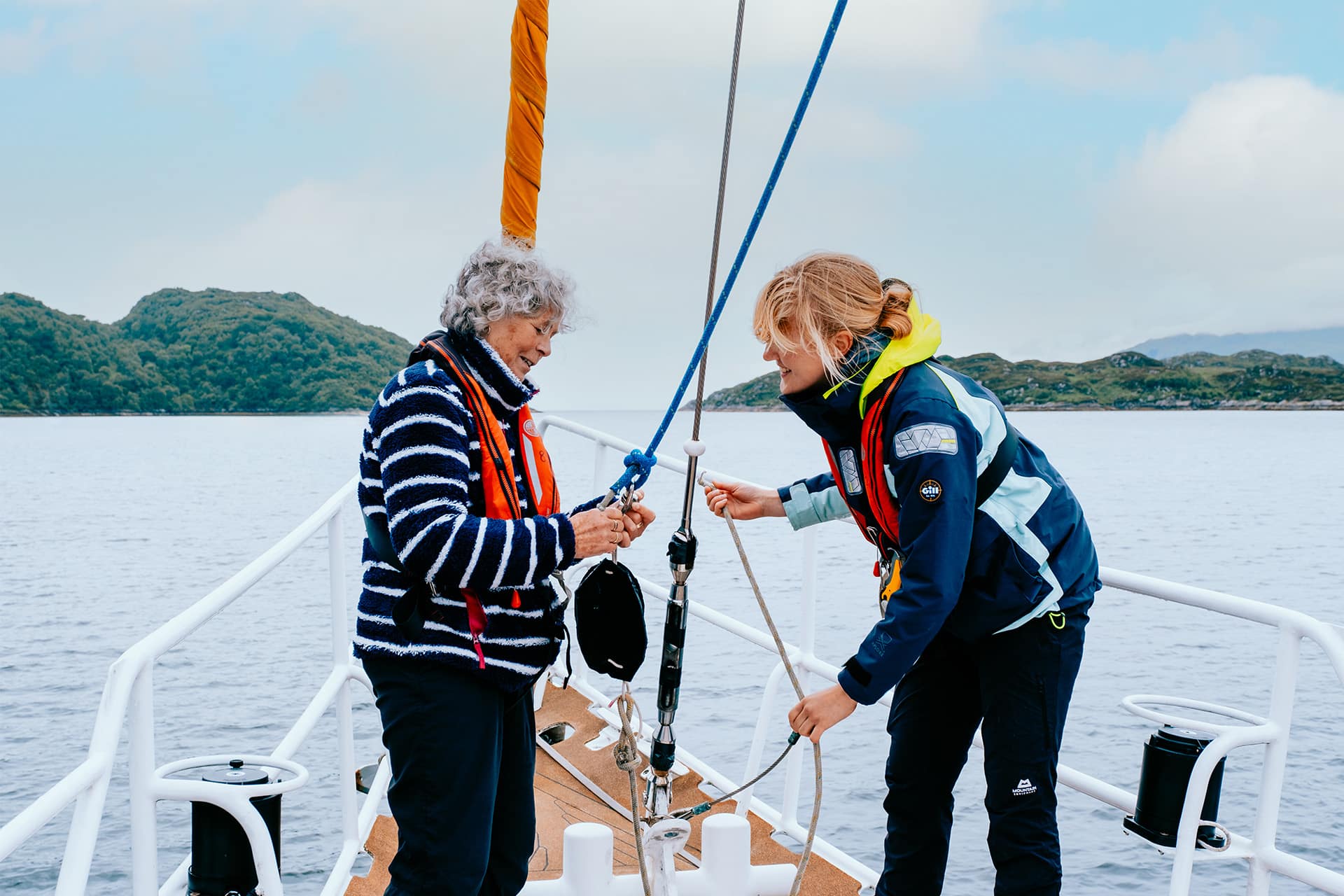 Zuza guests onboard ropework women sailors at bow